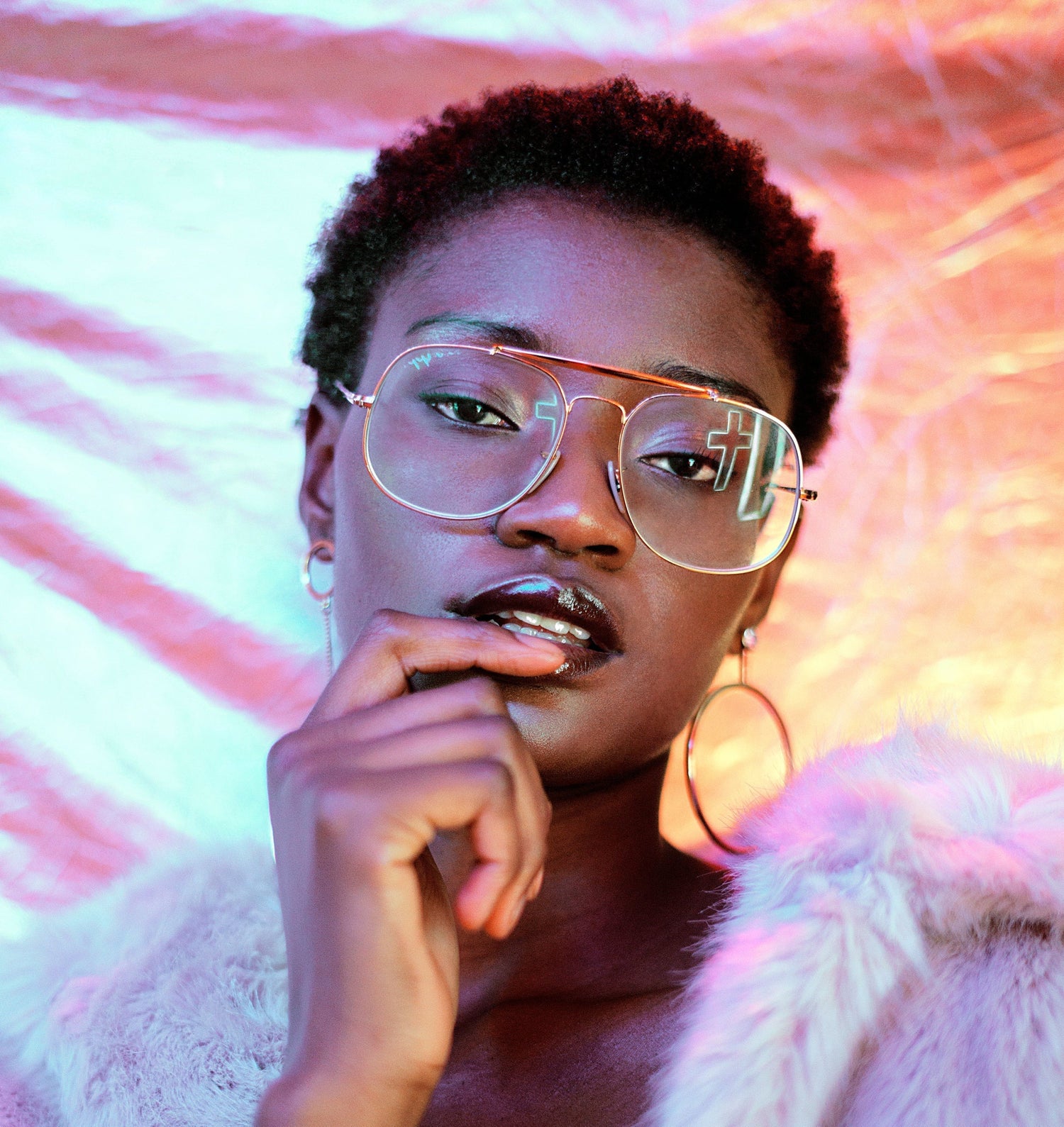 A young model in colorful lighting