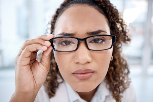 Portrait of black woman wearing black frame glasses