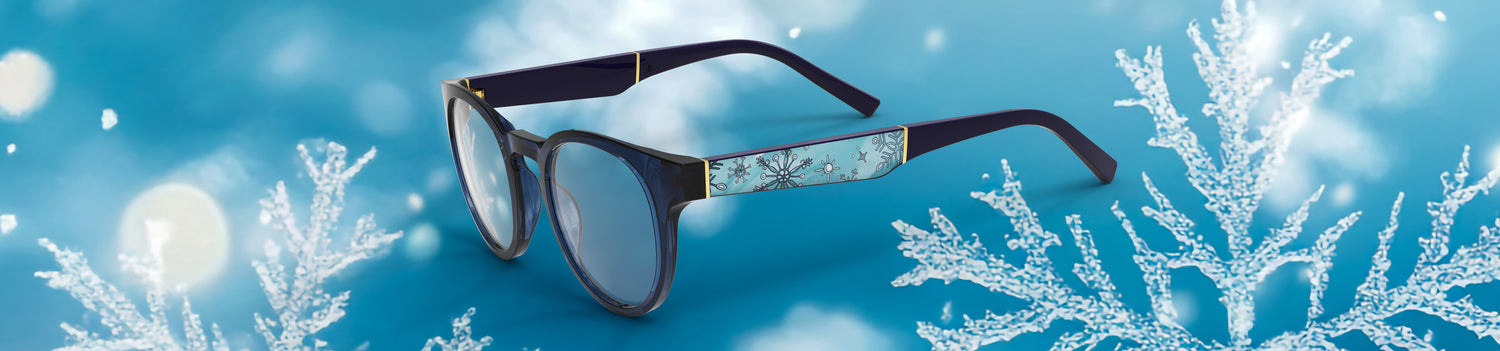 Glasses with floral design on a blue snowy background