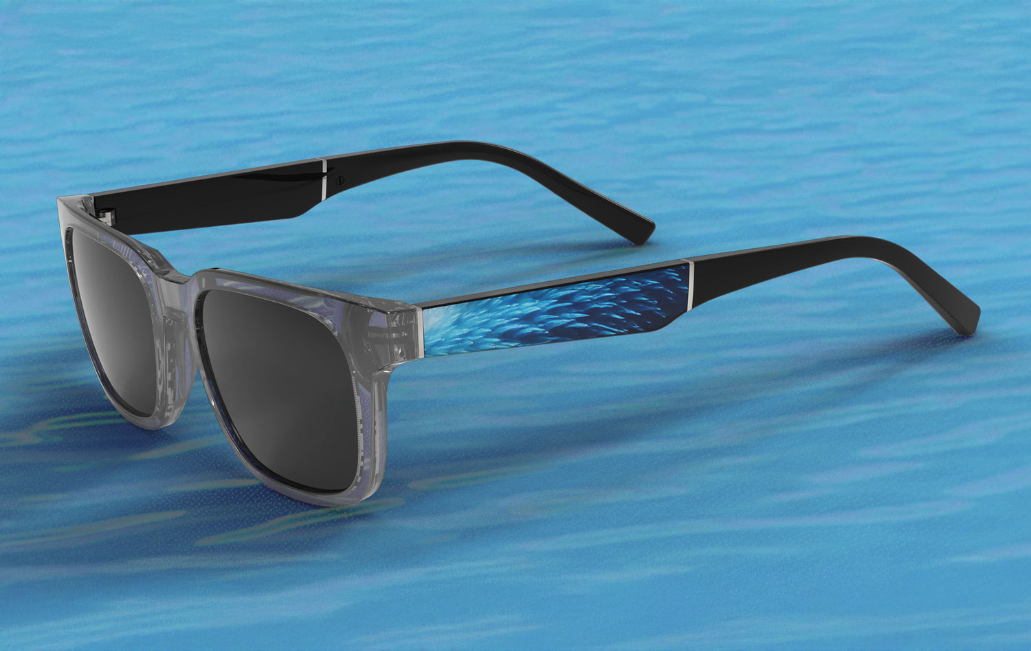 Sunglasses with black frames and dark lenses on a blue water background