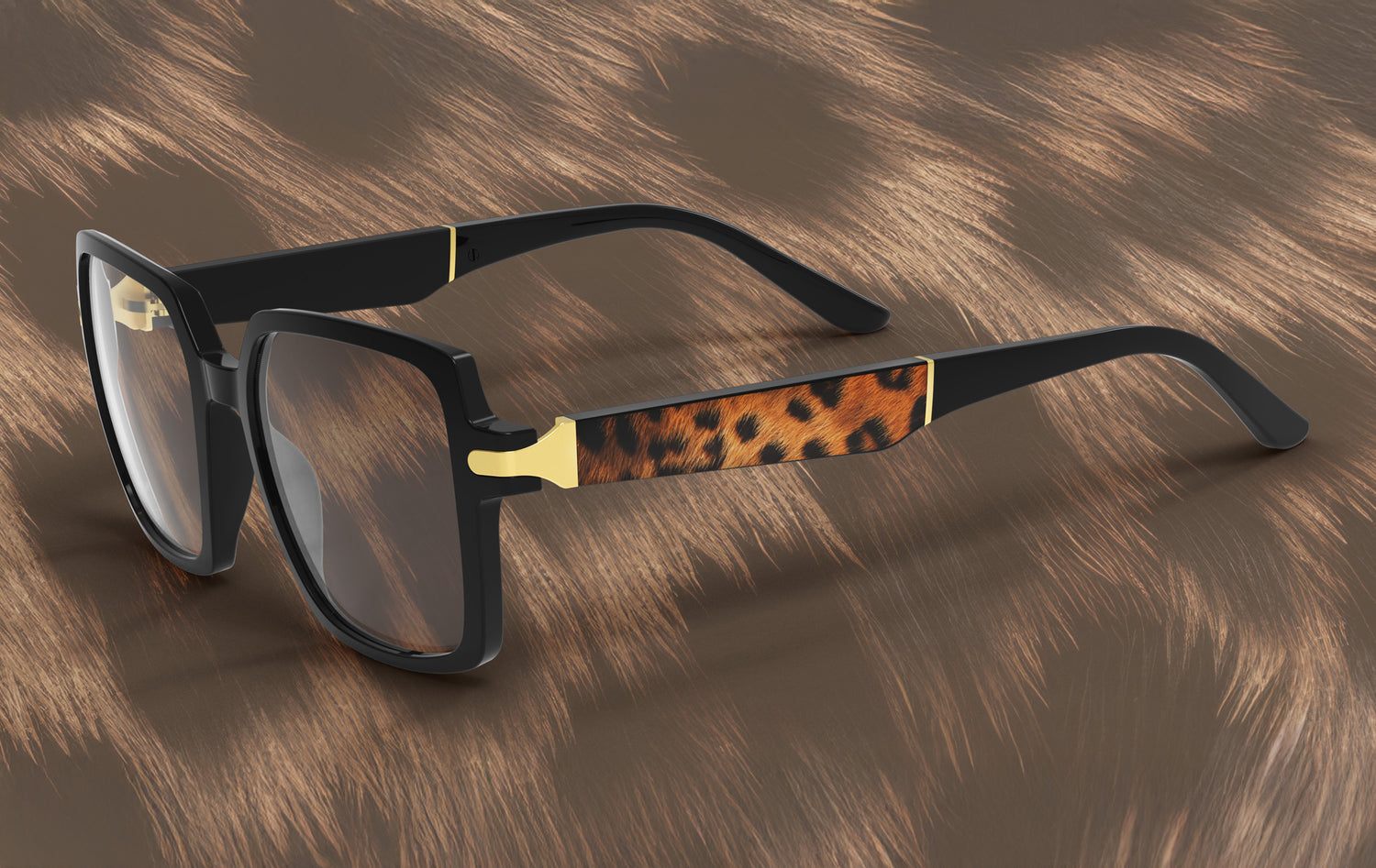 Glasses with black frame, tortoiseshell arm, and gold accents on a brown textured background