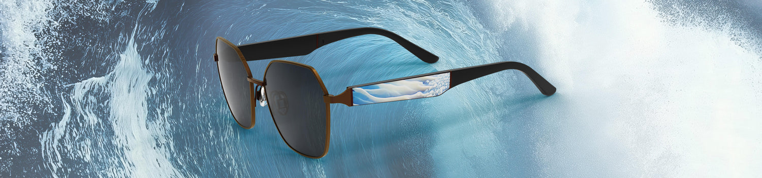 Sunglasses on a background of blue water with white foam