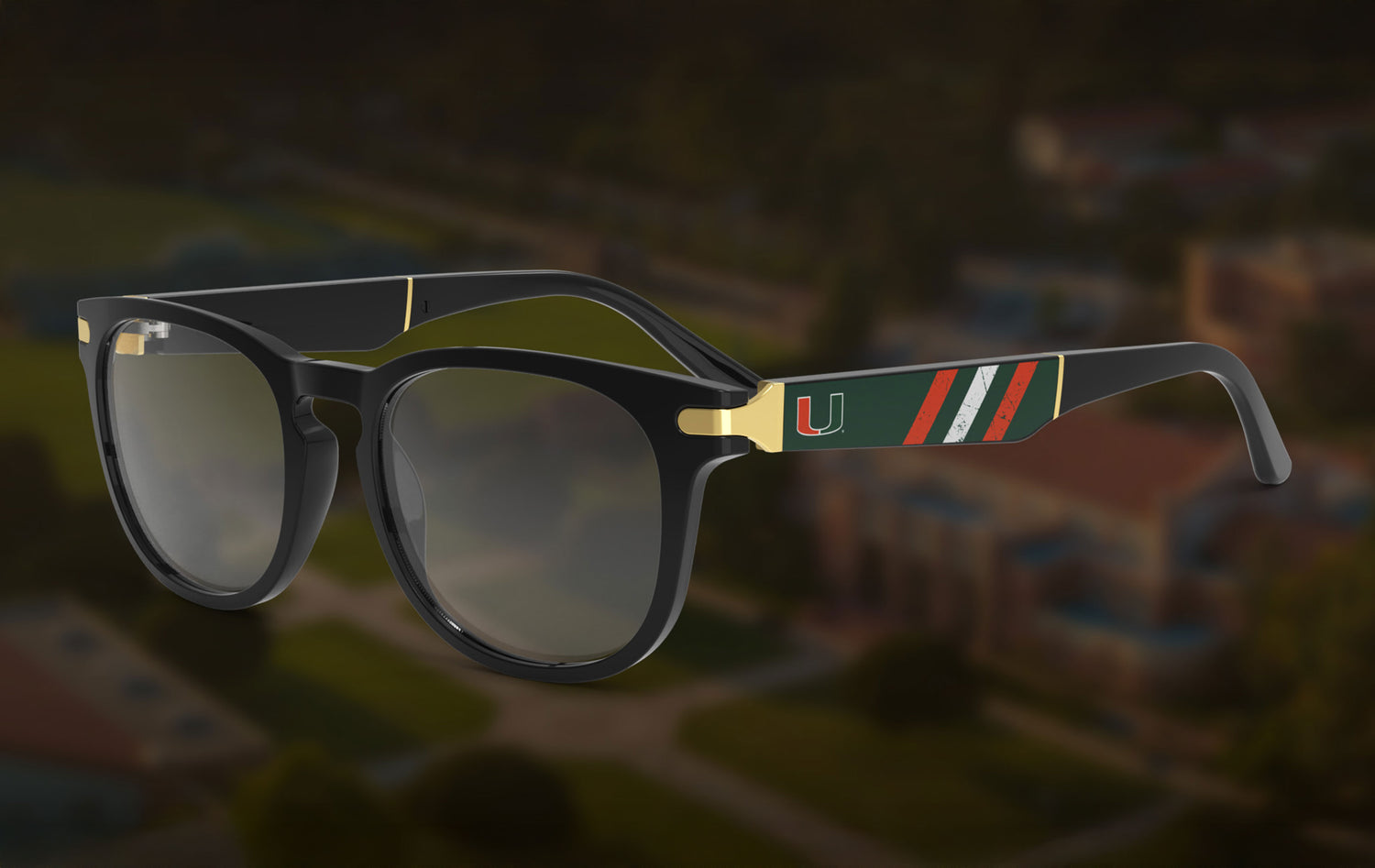 Eyewear with a the Miami Canes logo on a blurred stadium background