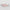 Two pink rectangular objects with black bow designs on a light gray background