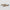 Two decorative rectangular objects with black and beige patterns on a gray background