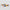 Two colorful striped rectangular objects on a light gray background