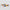 Two colorful striped rectangular objects on a light gray background
