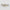 Two rectangular objects with black floral pattern on beige