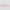 Two objects with a watercolor pattern on a light gray background