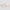 Two objects with a watercolor pattern on a light gray background