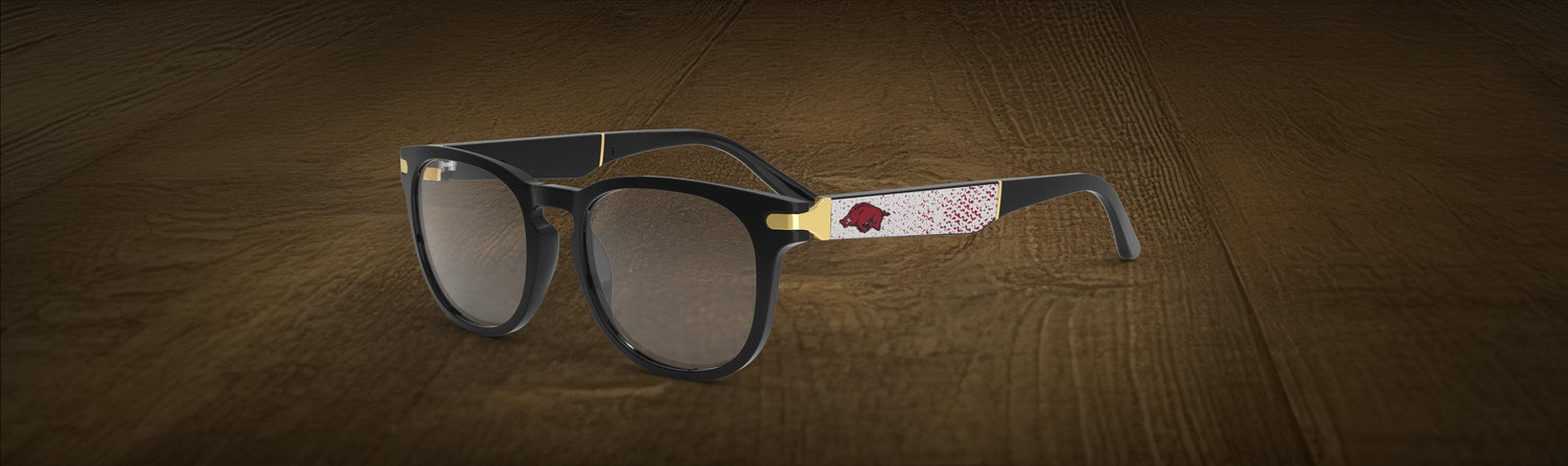 Glasses with a brand logo on a wooden surface