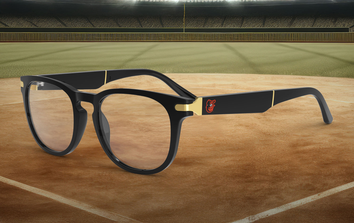 Black-framed glasses with the Baltimore Orioles logo on it against a baseball field background