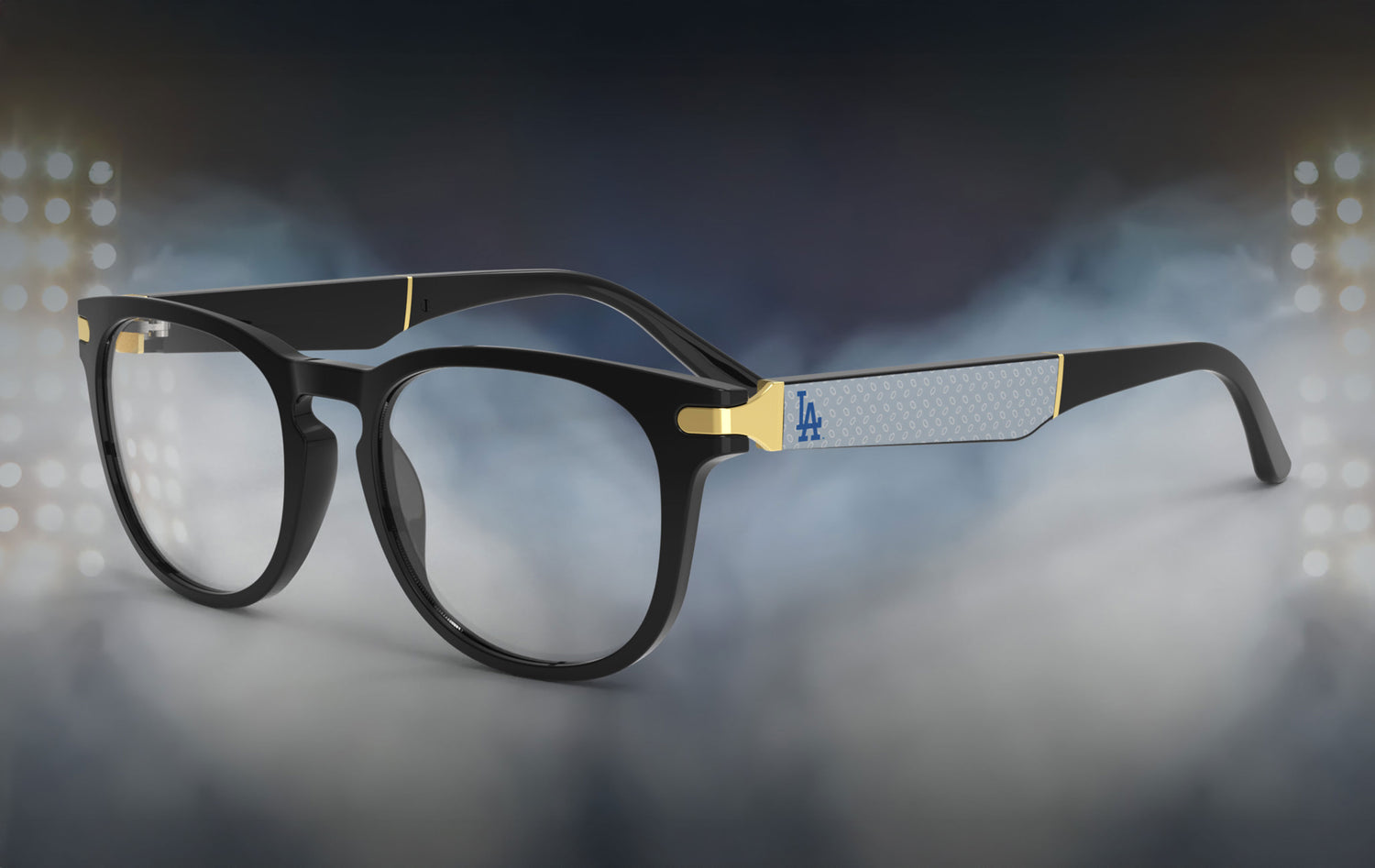 Black eyeglasses with gold accents on a blurred night-lit background