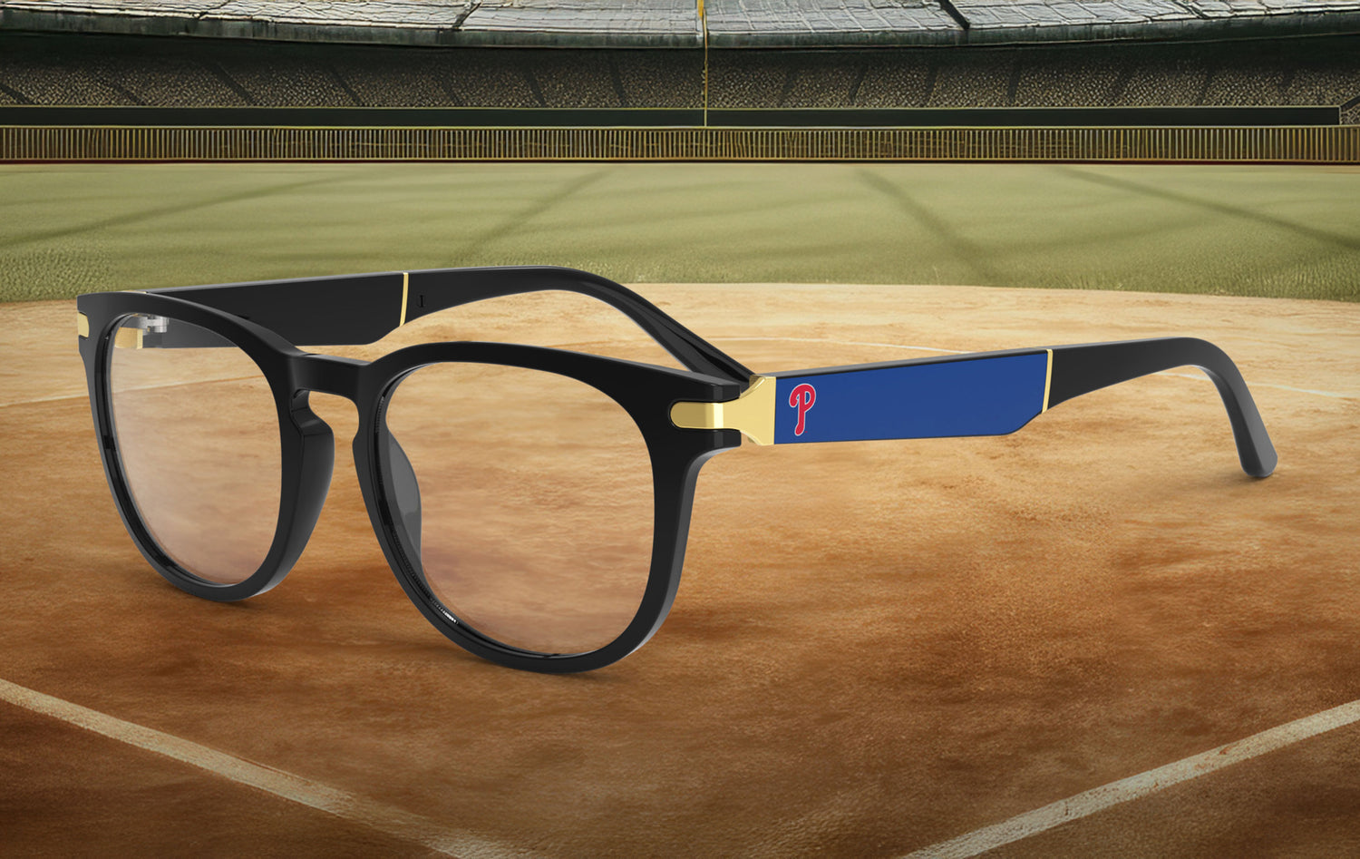 Glasses with a blue and gold Phillies logo on a baseball field background