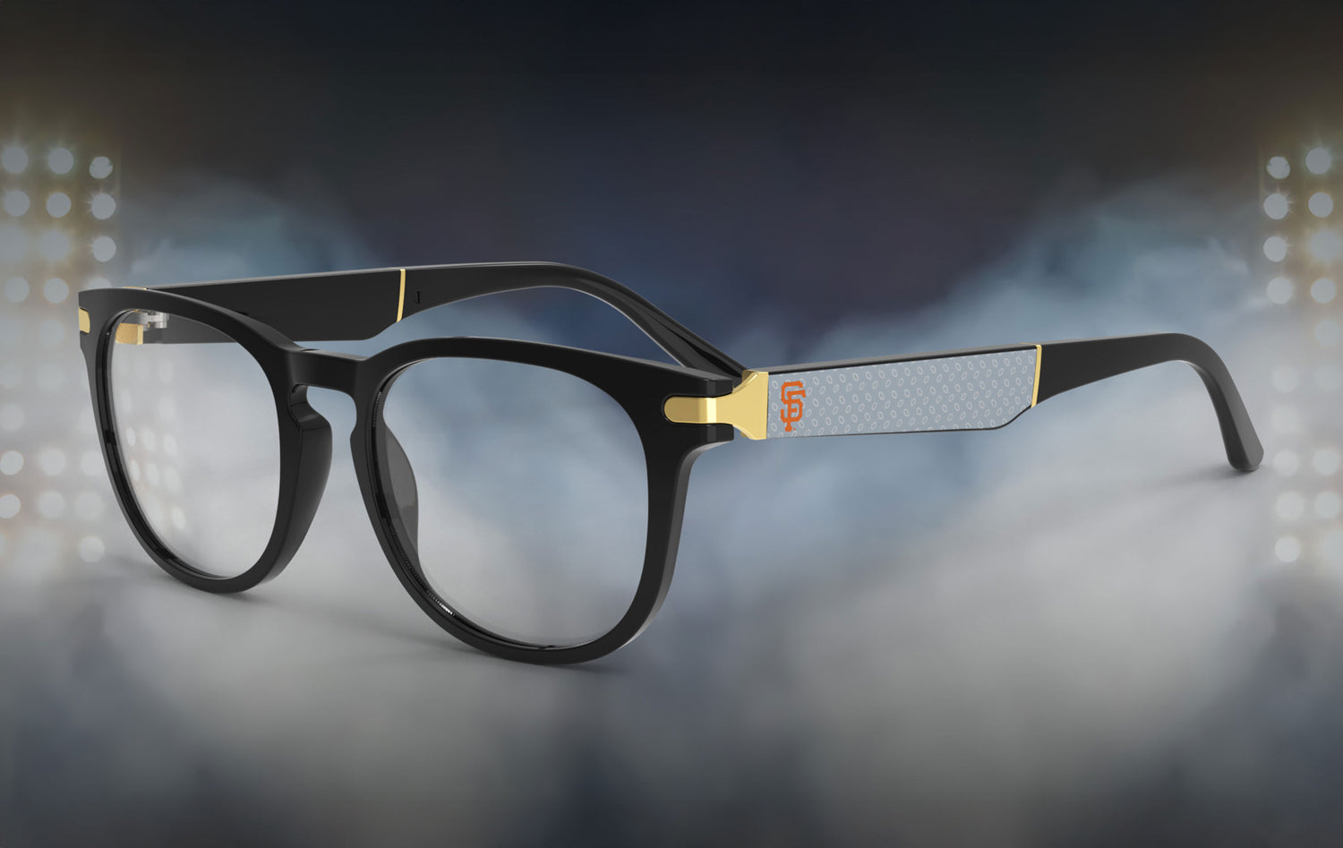Black eyeglasses with gold accents on a night-lit background