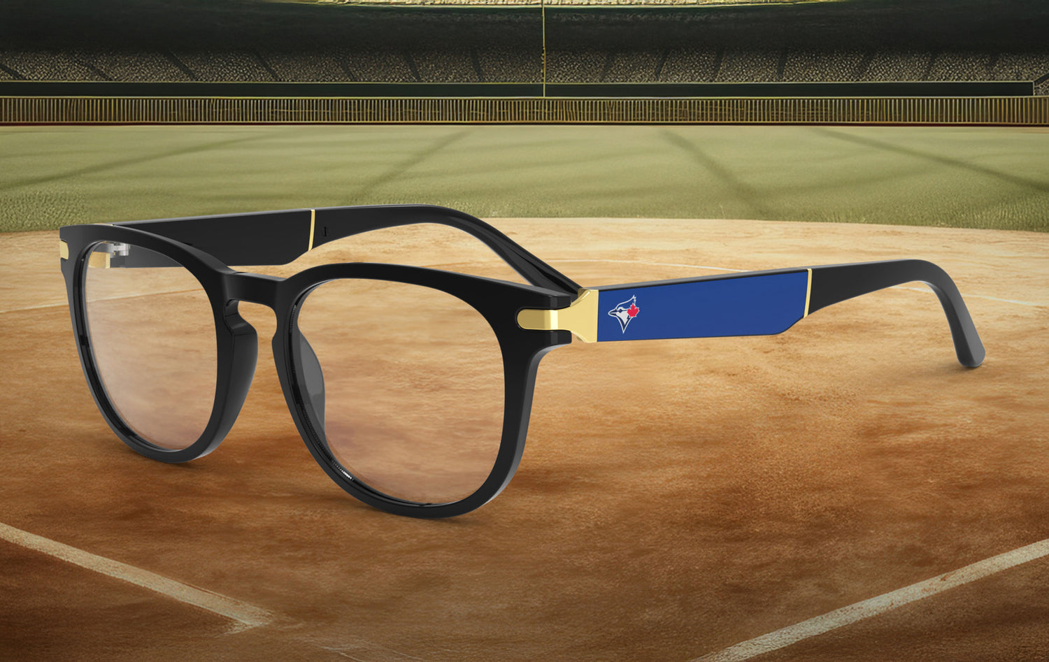 Black-framed glasses with the Toronto Blue Jays logo on a baseball field background