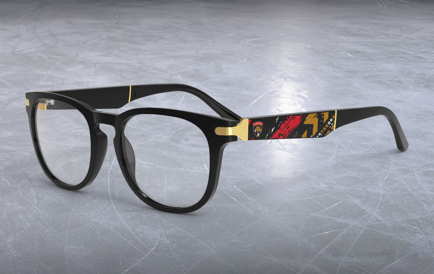 Black eyeglasses with red and yellow accents on a gray textured background
