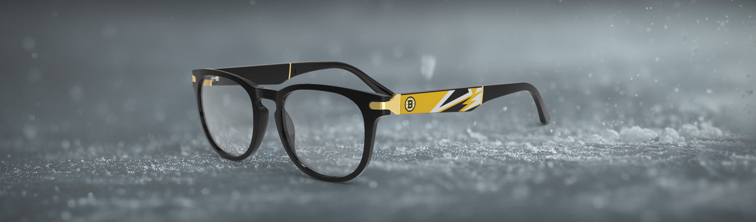 Black-frame eyeglasses with black and yellow geometric design on temple with Boston Bruins logo