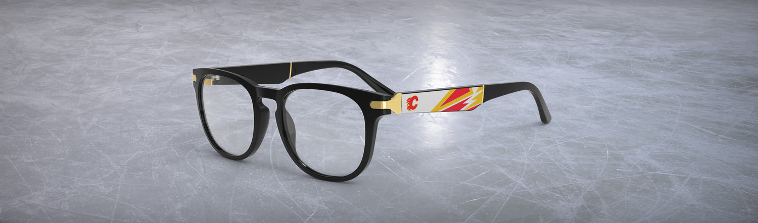 Allegiant glasses with temple blade showing Calgary Flames logo against a red and gold abstract design in a hockey rink setting.
