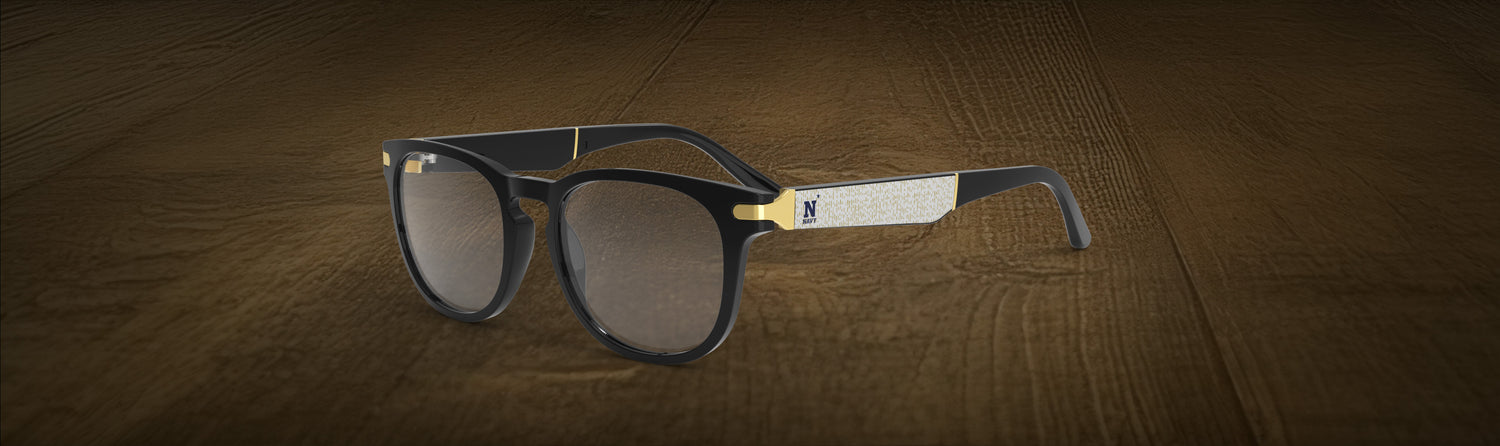 Glasses with a brand logo on a wooden surface