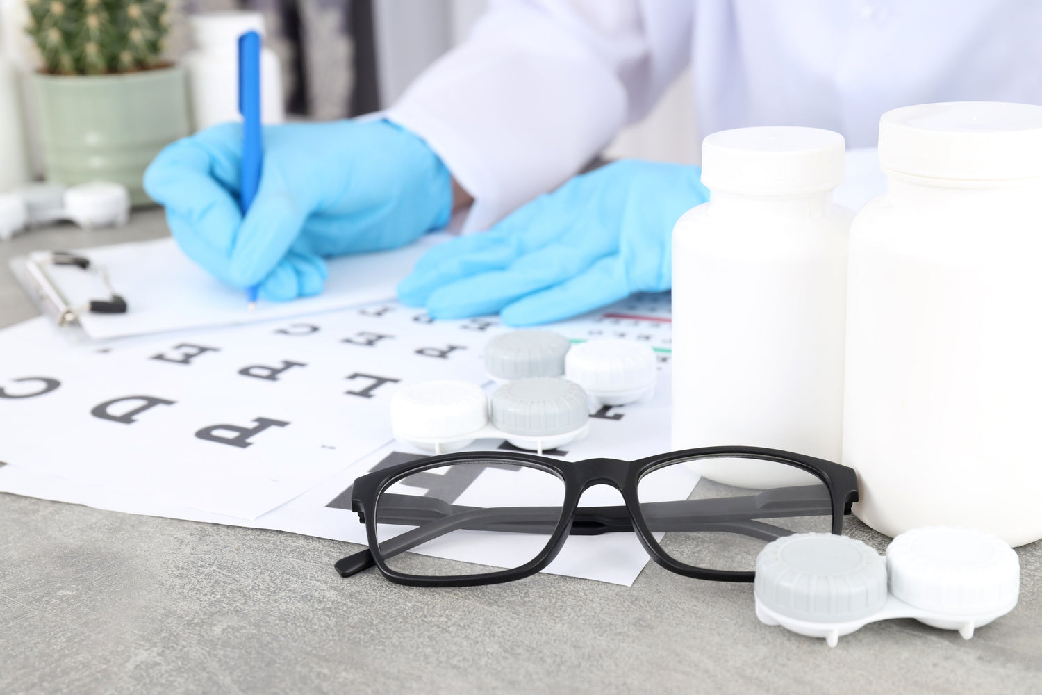 Optometrist writing a prescription for eye glasses