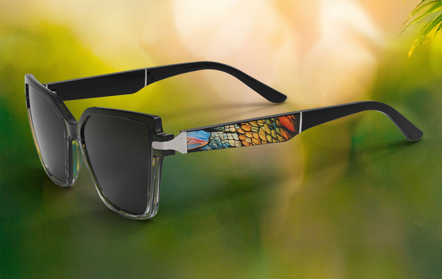 Sunglasses with colorful pattern on arm against a blurred natural background