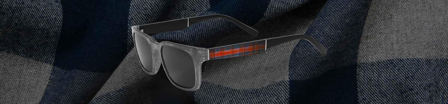 Sunglasses on a checkered fabric background
