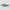 Two green patterned objects on a light gray background