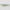 Two green snakeskin patterned objects on a gray background