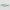 Two green and white patterned blades on a light gray background