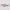 Two pink rectangular objects with black butterfly patterns on a light gray background