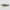 Two eyewear blades with green snakeskin patterns on a light gray background background