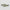 Two eyewear blades with green snakeskin patterns on a light gray background background.
