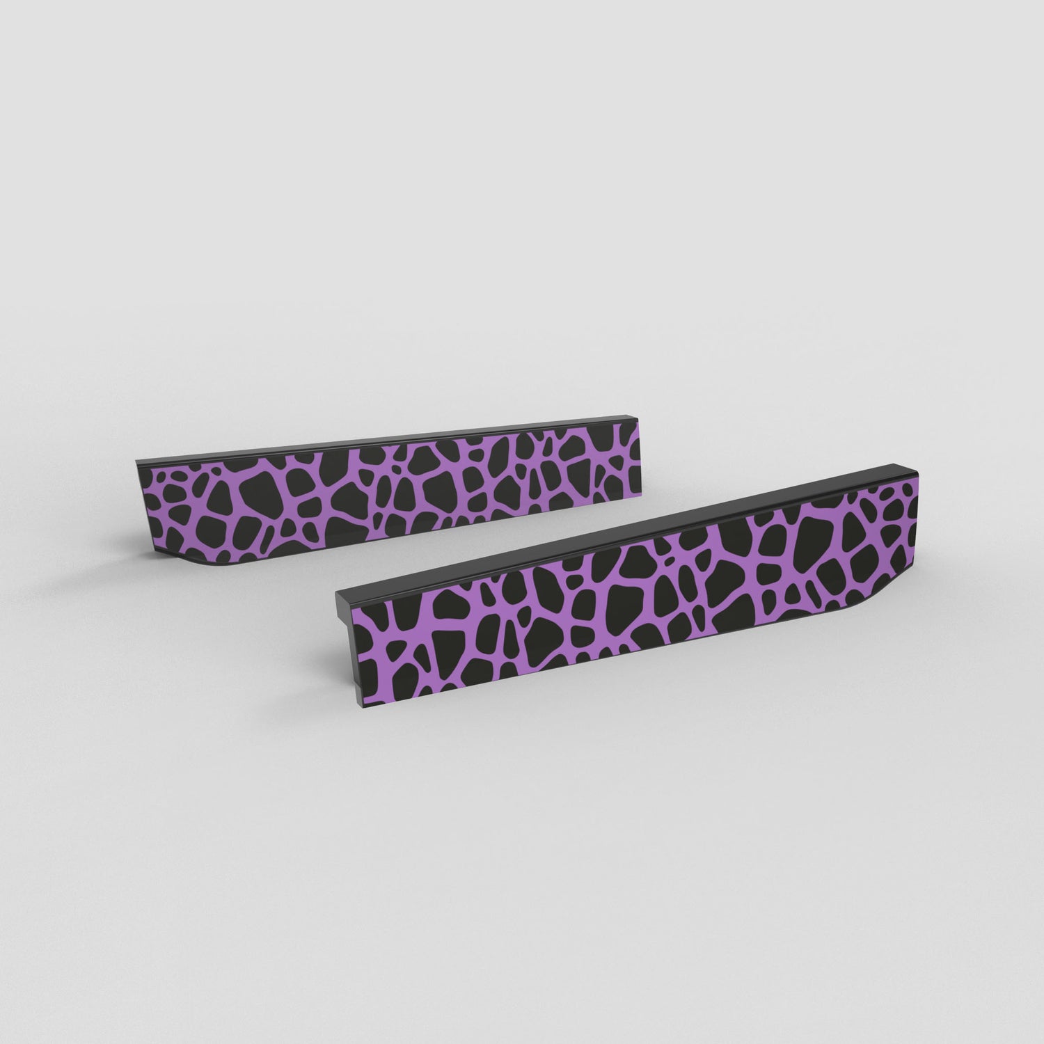 Two black rectangular objects with purple geometric pattern on a light gray background