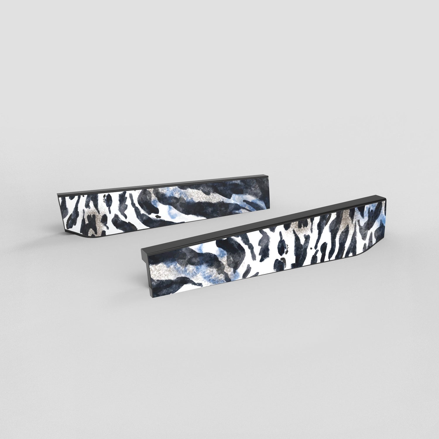 Two rectangular objects with a black and white zebra pattern on a gray background