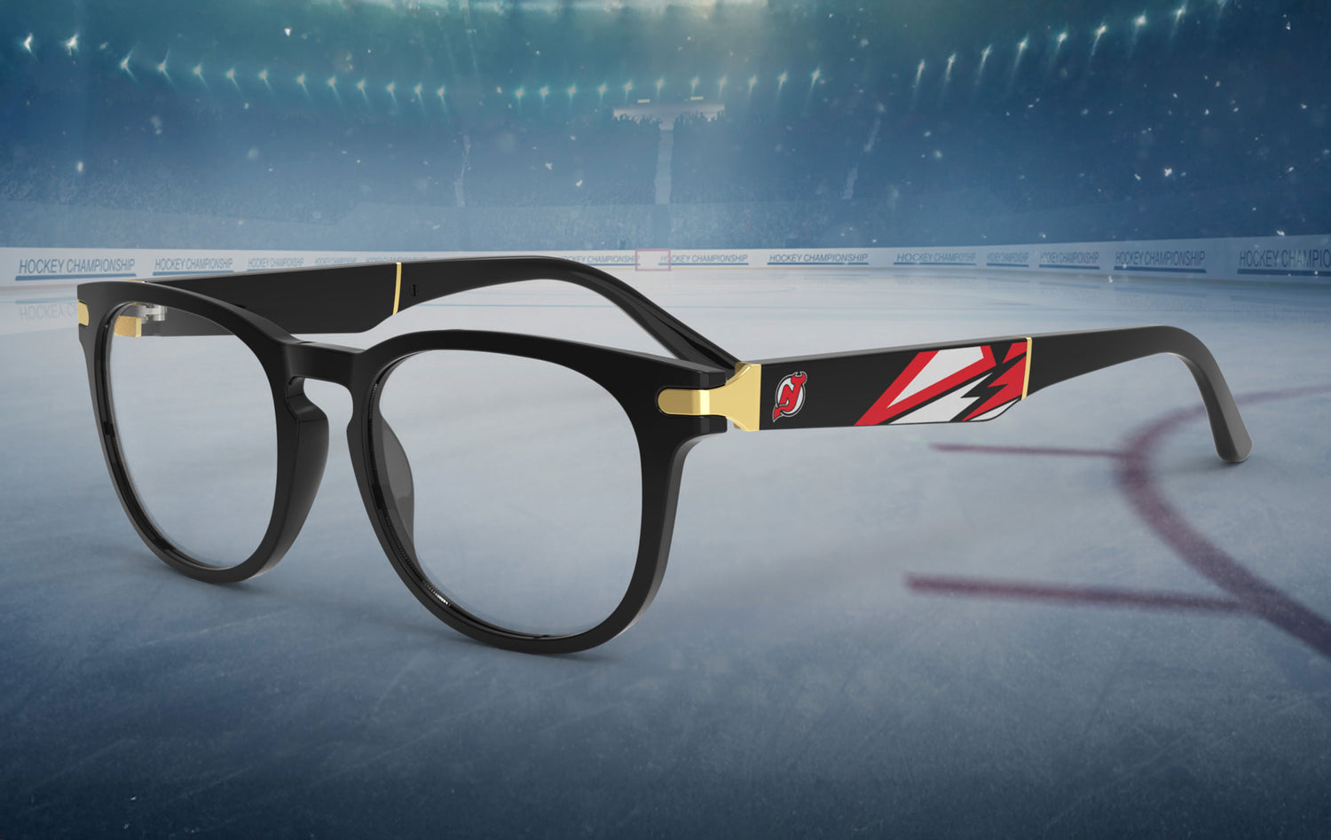 Glasses with a black frame featuring red and gold accents on an ice hockey rink.