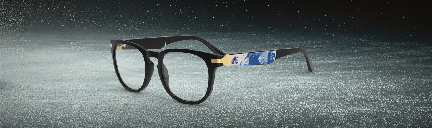 Eyeglasses with a black frame on a textured gray background