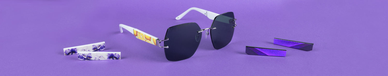 Sunglasses with colorful arm designs on a purple background