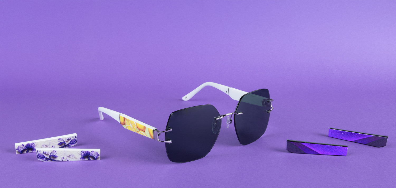 Sunglasses with colorful arm designs on a purple background