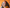 Happy lady with glasses and an orange headband against an orange background